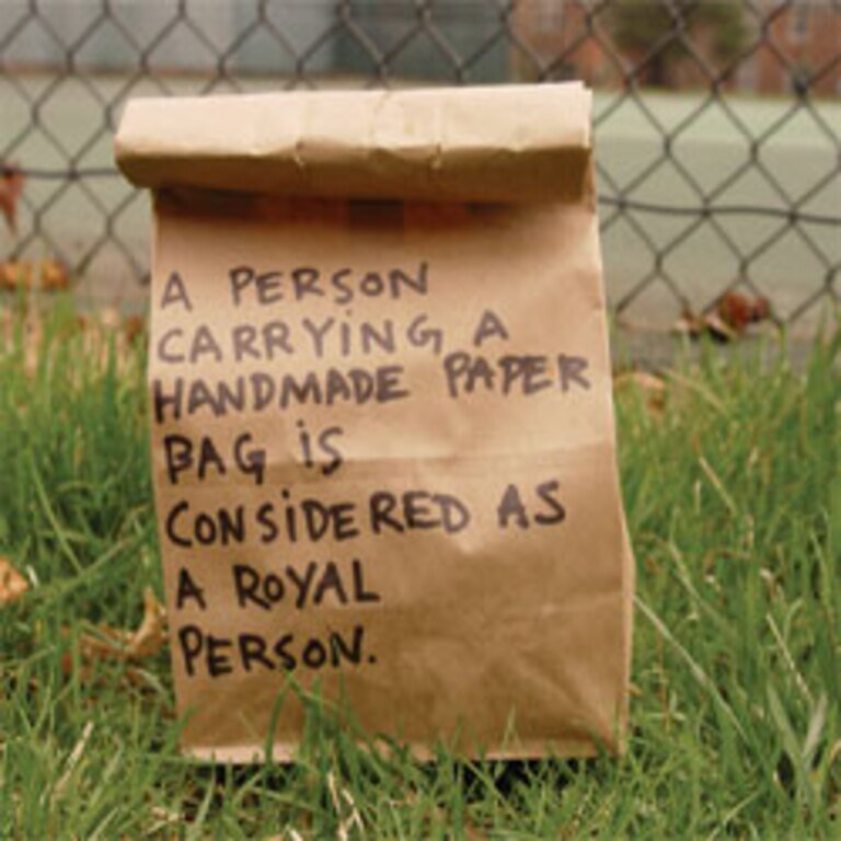 A Person Carrying A Handmade Paper Bag.. A Person Carrying A Handmade Paper Bag..